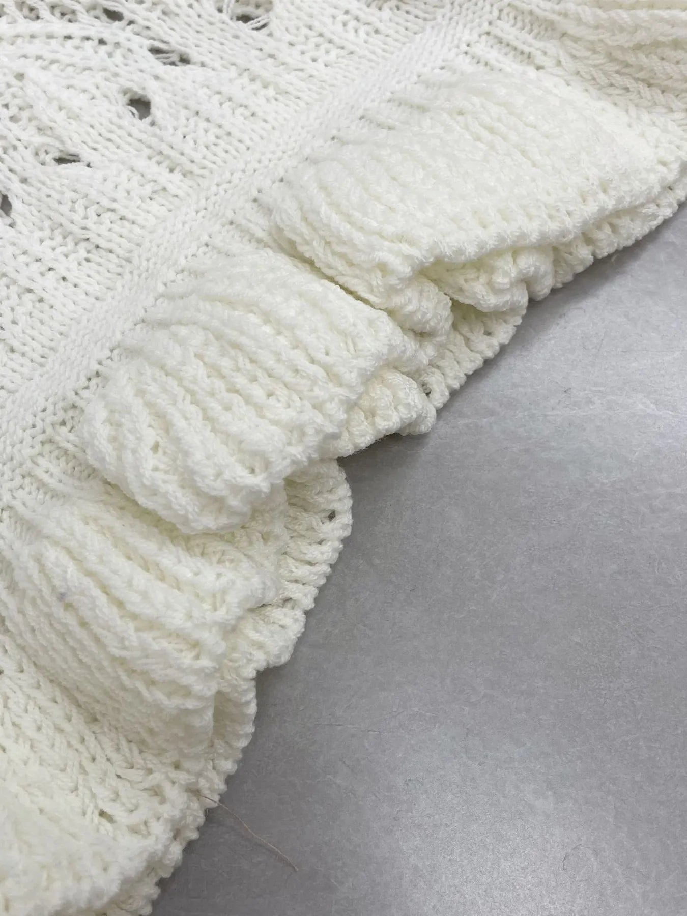 Trendsi Crochet Ruffled Hem Long Sleeve Sweater