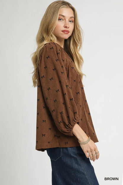 Trendsi Umgee Corduroy Bow Print Balloon Sleeve Blouse