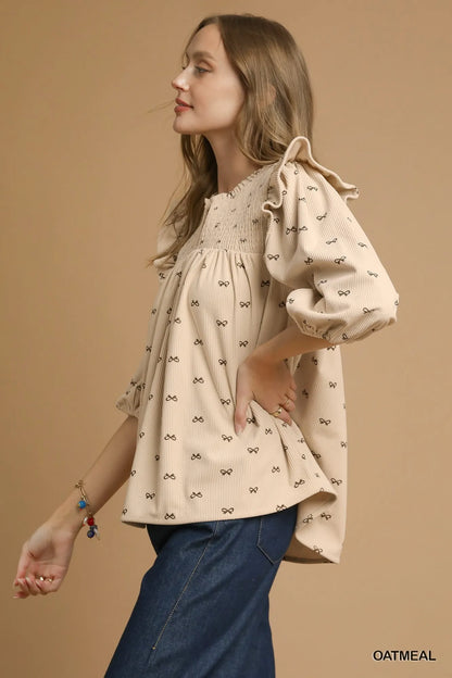 Trendsi Umgee Bow Print Corduroy Puff Sleeve Blouse with Ruffled