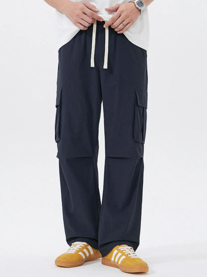 Men's Full Size Multi-Pocket Tactical Cargo Pants with Drawstring Waist Plus Size Navy Blue Easy Apparels