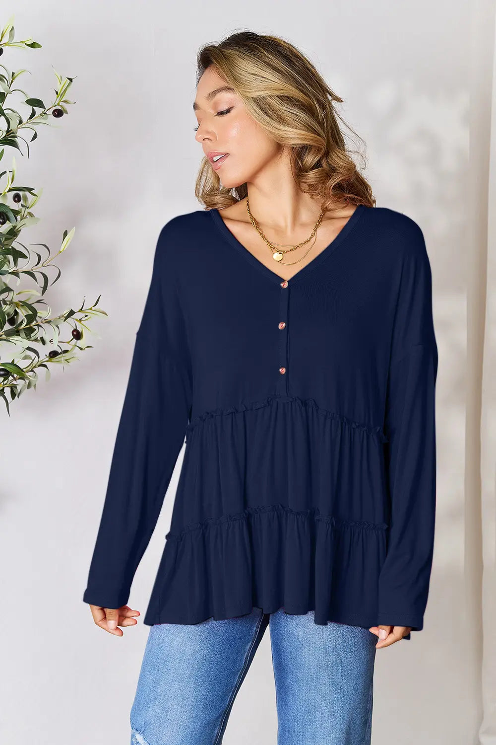 Trendsi Double Take Half Button Long Sleeve Ruffle Hem Blouse